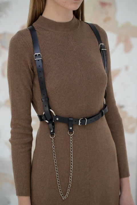 2. Close-up of Body Harness Milla by PYKOK on a woman, highlighting adjustable leather straps and metal chain detail
