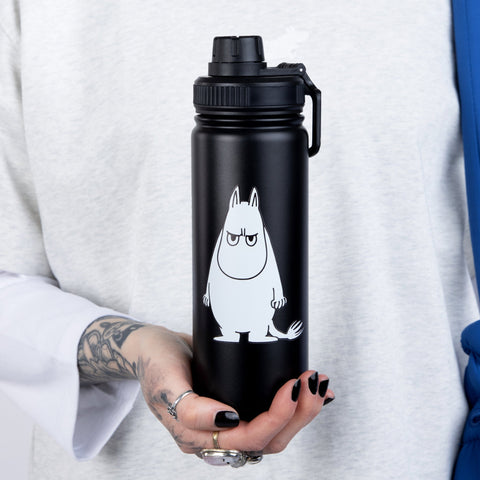 1. Moomintroll Thermal Everyday Bottle held by a person, showcasing black stainless steel design with Moomin print