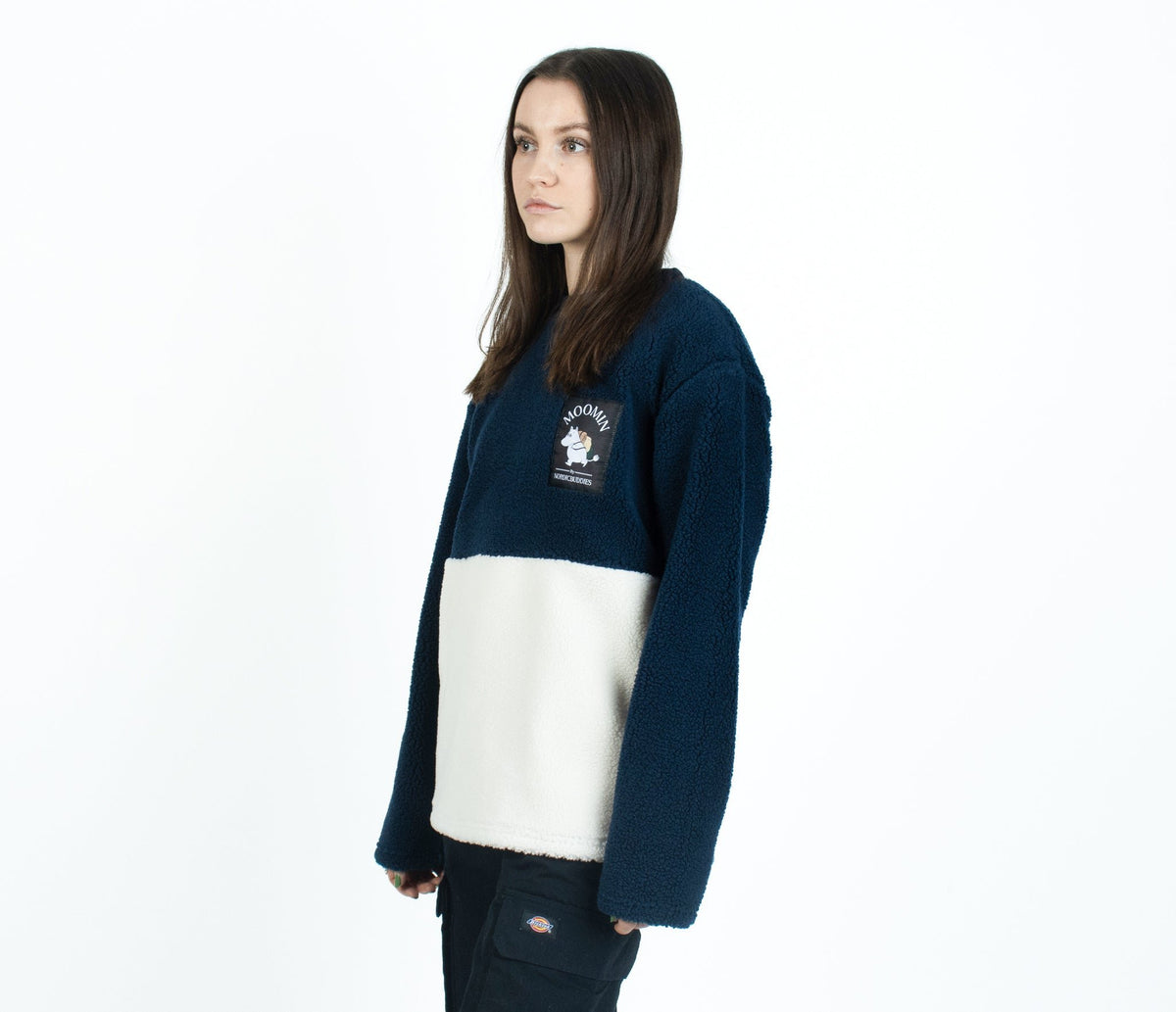 3. Woman in Moomin by NordicBuddies navy and white fleece, side view in studio