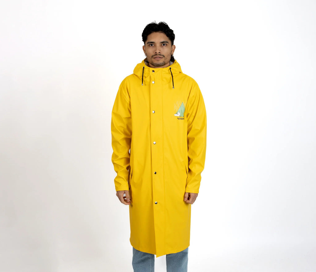 5. Male model wearing unisex yellow Moomin Adventure Rain Jacket in studio setting