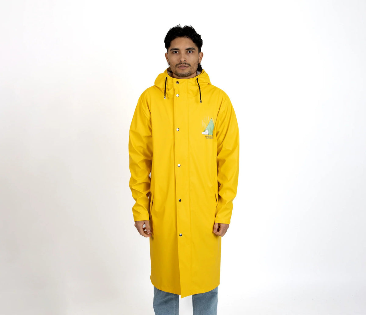 5. Male model wearing unisex yellow Moomin Adventure Rain Jacket in studio setting