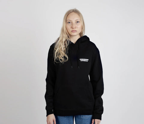 3. Unisex black Moomintroll's Temper Hoodie by NordicBuddies worn by female model in studio