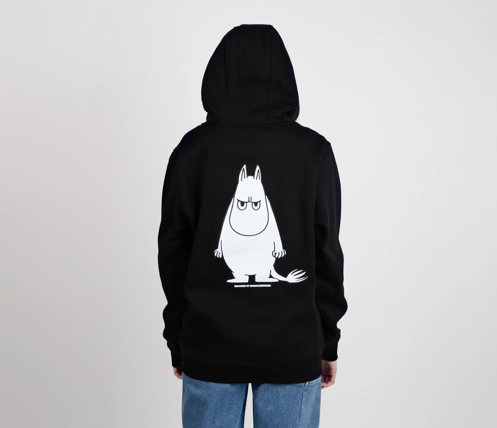 2. Back view of unisex black Moomintroll's Temper Hoodie with Moomin graphic, worn by female model