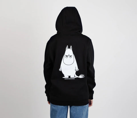 2. Back view of unisex black Moomintroll's Temper Hoodie with Moomin graphic, worn by female model
