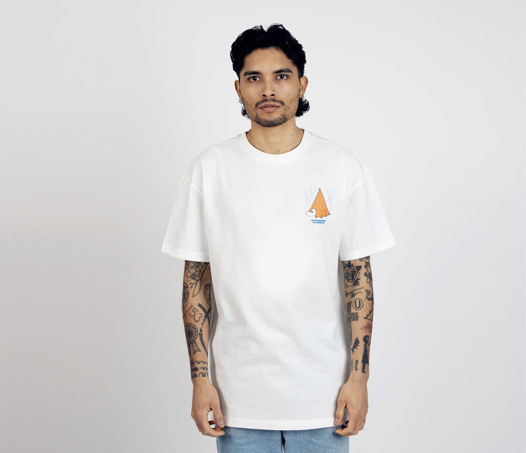 7. Unisex white Moomin Adventure T-Shirt worn by male model, front view with small tent graphic on chest