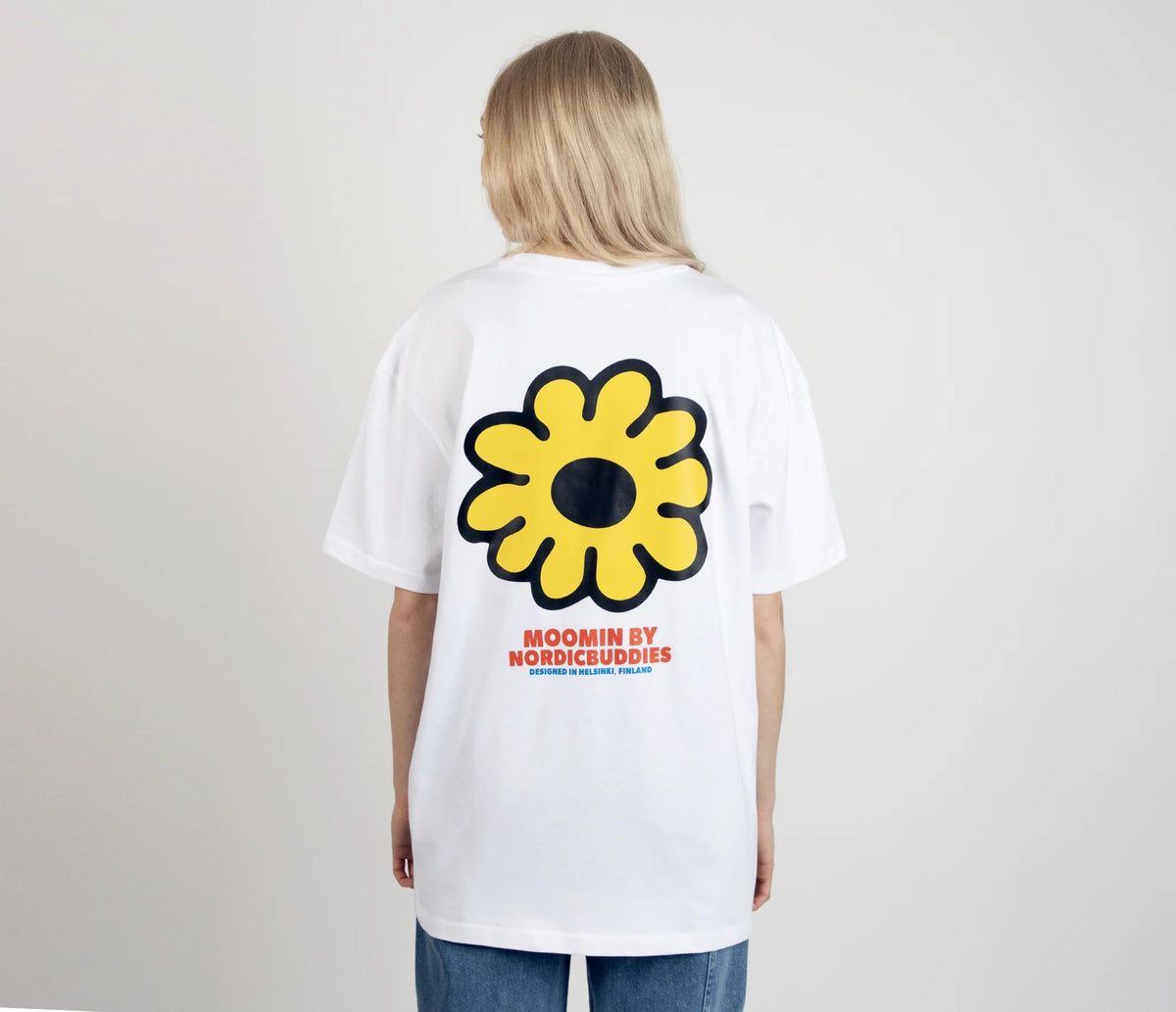 6. Women's Moomintroll's Flower T-Shirt by NordicBuddies, featuring large yellow flower graphic on back, shown in studio