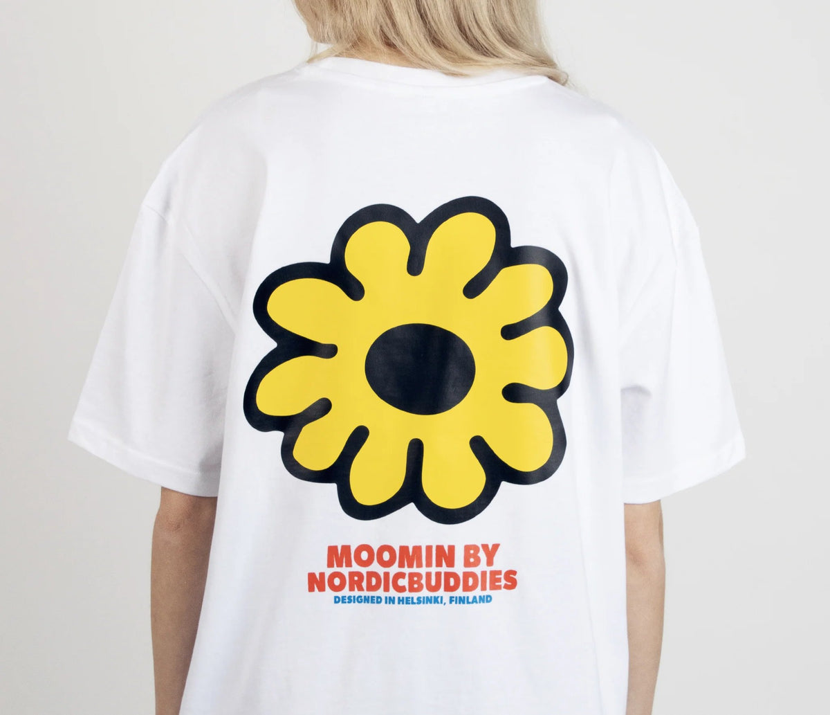 1. Women's Moomintroll's Flower T-Shirt by NordicBuddies, featuring large yellow flower graphic on back, shown in studio