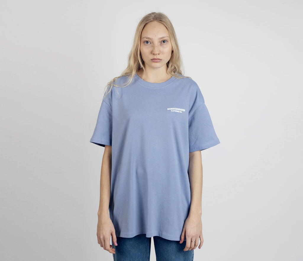 2. Women's unisex blue Moomintroll's Adventure T-shirt with NordicBuddies logo, shown from front in studio