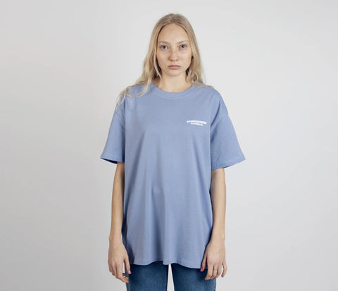 2. Women's unisex blue Moomintroll's Adventure T-shirt with NordicBuddies logo, shown from front in studio