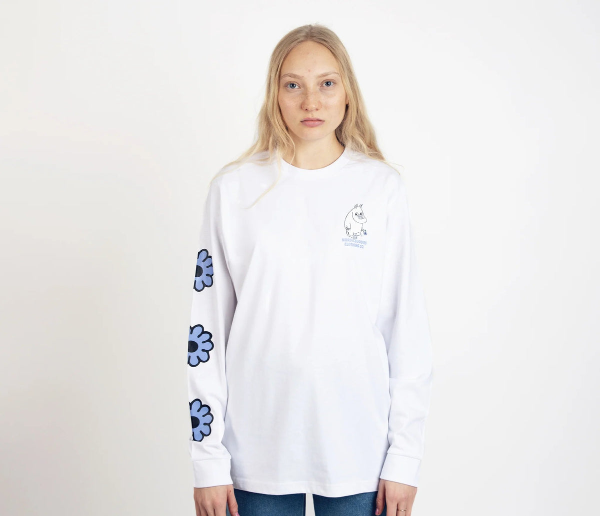 1. Unisex white Moomintroll's Flower longsleeve shirt worn by female model, featuring blue floral sleeve design and cuffrib, studio setting