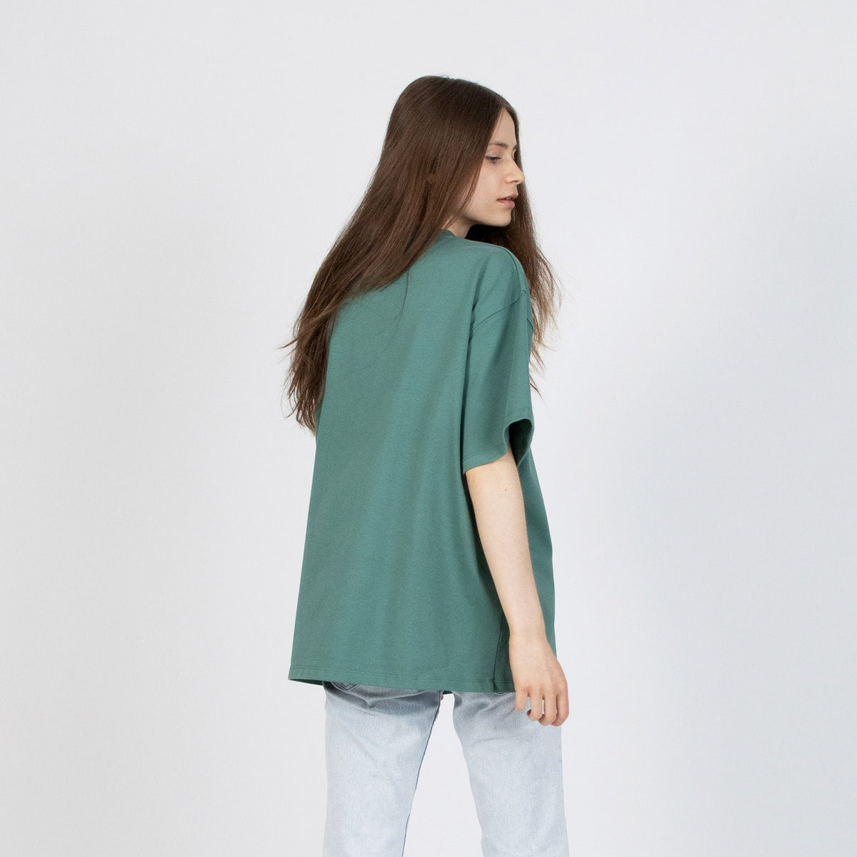 3. Women's green Moomin Classics heavy t-shirt shown from the back with relaxed fit