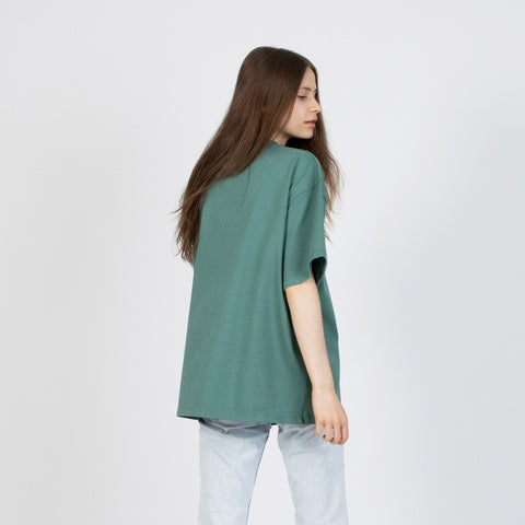 3. Women's green Moomin Classics heavy t-shirt shown from the back with relaxed fit