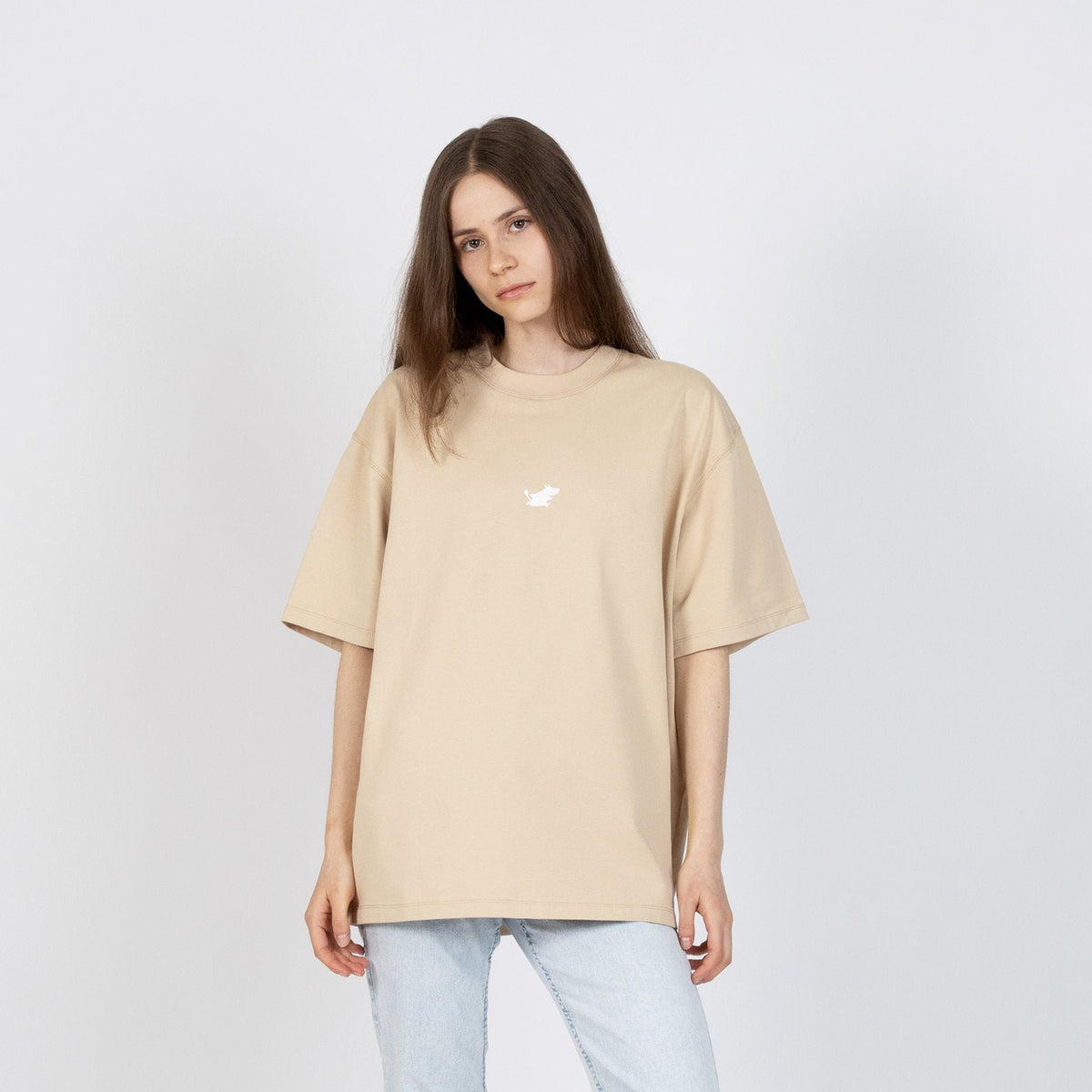 2. Women's beige Moomin Classics heavy t-shirt styled with light denim, shown in front view