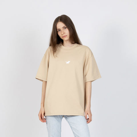 2. Women's beige Moomin Classics heavy t-shirt styled with light denim, shown in front view