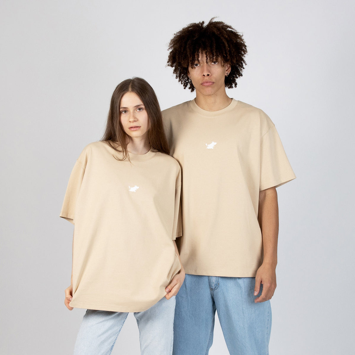 1. Unisex beige Moomin Classics heavy t-shirt worn by male and female models in studio