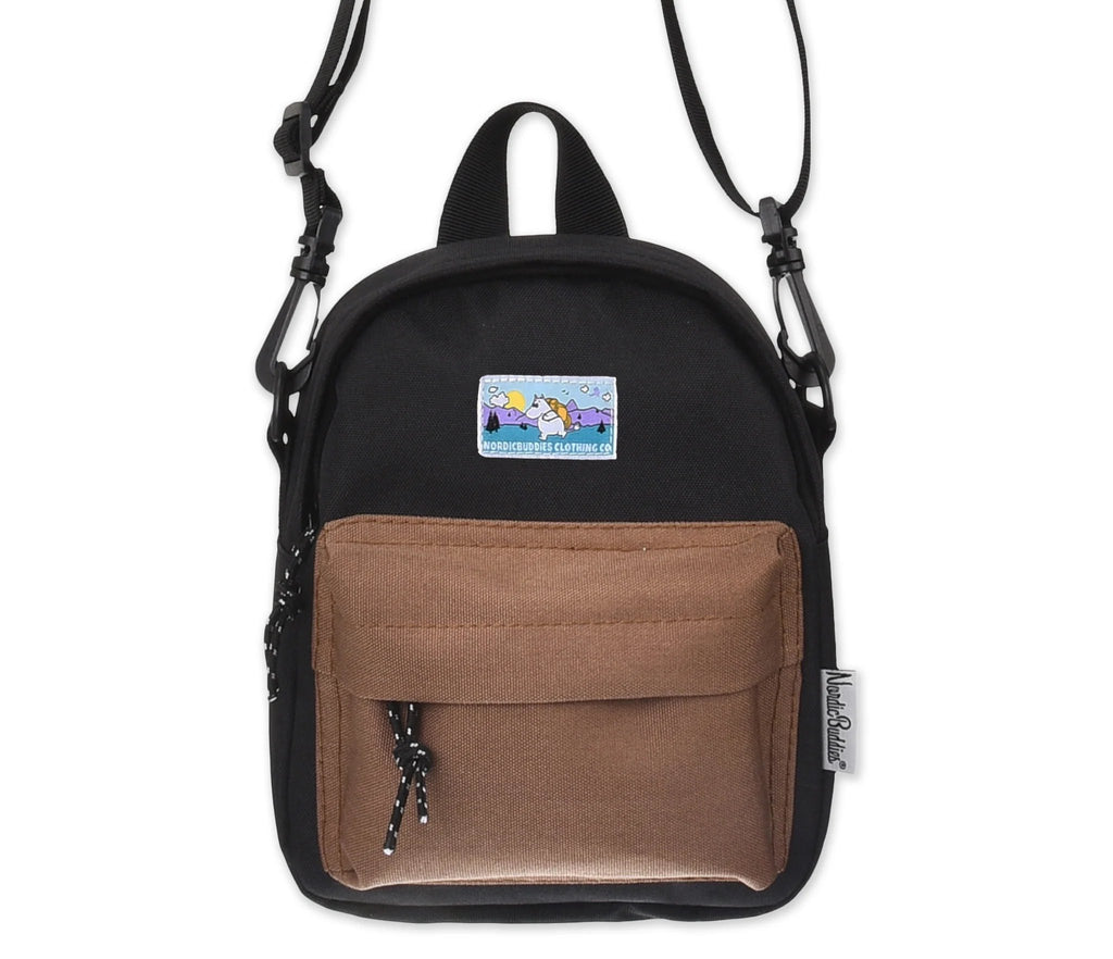 1. Moomintroll Adventure Cross Body Bag in black and brown with front pocket and Moomin patch, studio shot