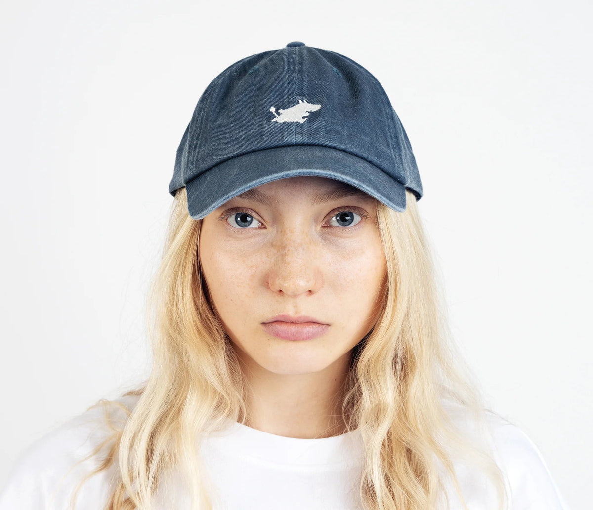 4. Front view of unisex blue Moomintroll washed denim cap on female model
