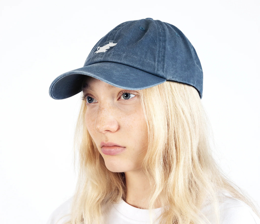 3. Unisex blue Moomintroll washed denim cap worn by female model in studio