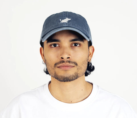 1. Unisex blue Moomintroll washed denim cap worn by male model in studio