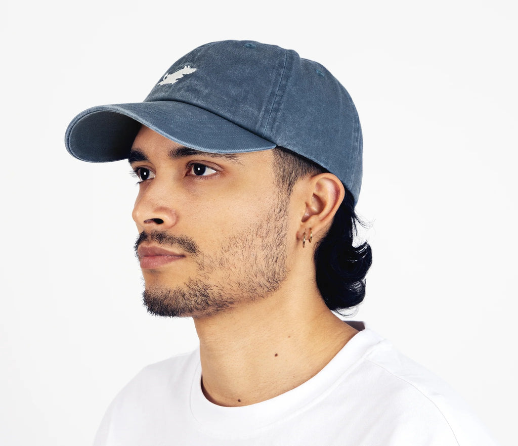 2. Side view of unisex blue Moomintroll washed denim cap on male model