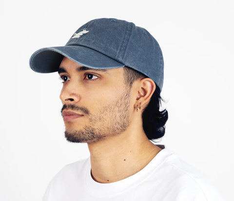 2. Side view of unisex blue Moomintroll washed denim cap on male model