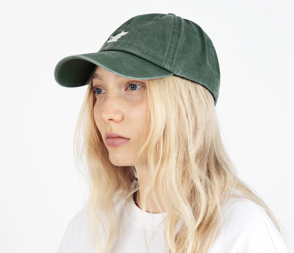 3. Woman wearing Moomintroll washed denim cap in green by NordicBuddies, side view