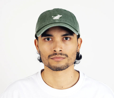 2. Man wearing Moomintroll washed denim cap in green by NordicBuddies, front view