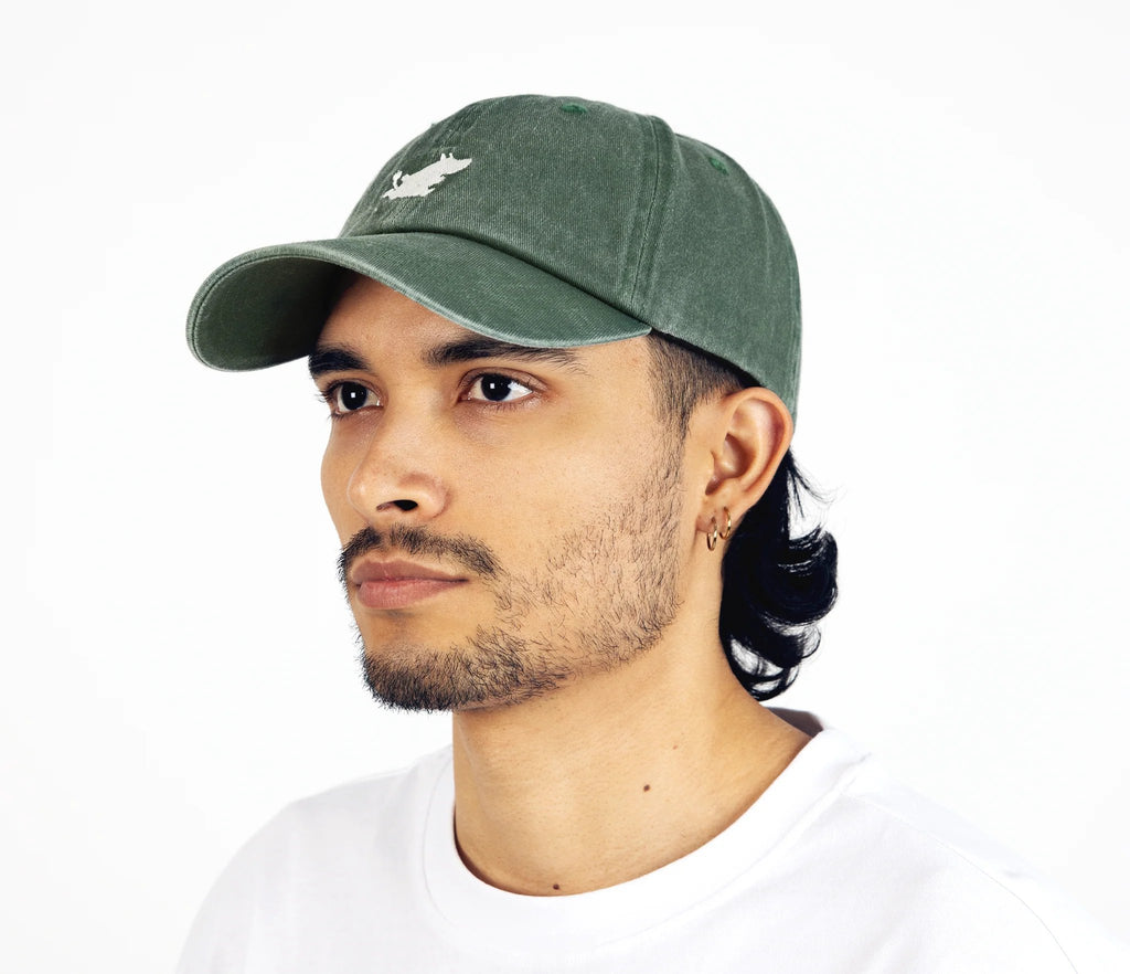 4. Man wearing Moomintroll washed denim cap in green by NordicBuddies, side view