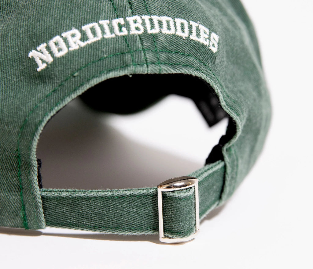 6. Close-up of adjustable strap and NordicBuddies logo on green Moomintroll denim cap
