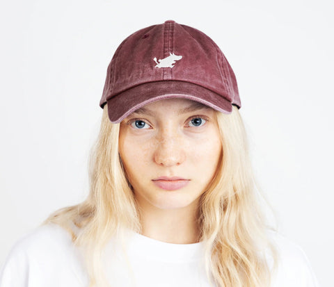 3. Woman wearing Moomintroll washed denim cap in burgundy by NordicBuddies, front view