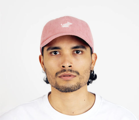 1. Unisex pink Moomintroll corduroy cap worn by male model in studio