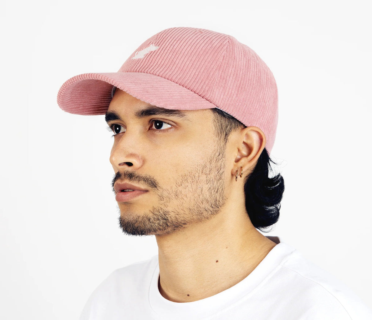 4. Unisex pink Moomintroll corduroy cap worn by male model in studio, side profile