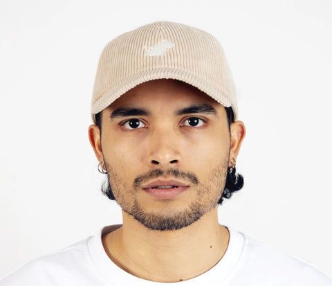 3. Unisex sand Moomintroll corduroy cap worn by male model, front view