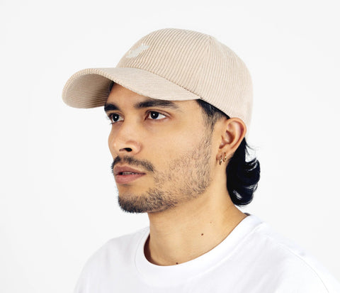 2. Unisex sand Moomintroll corduroy cap worn by male model, side view