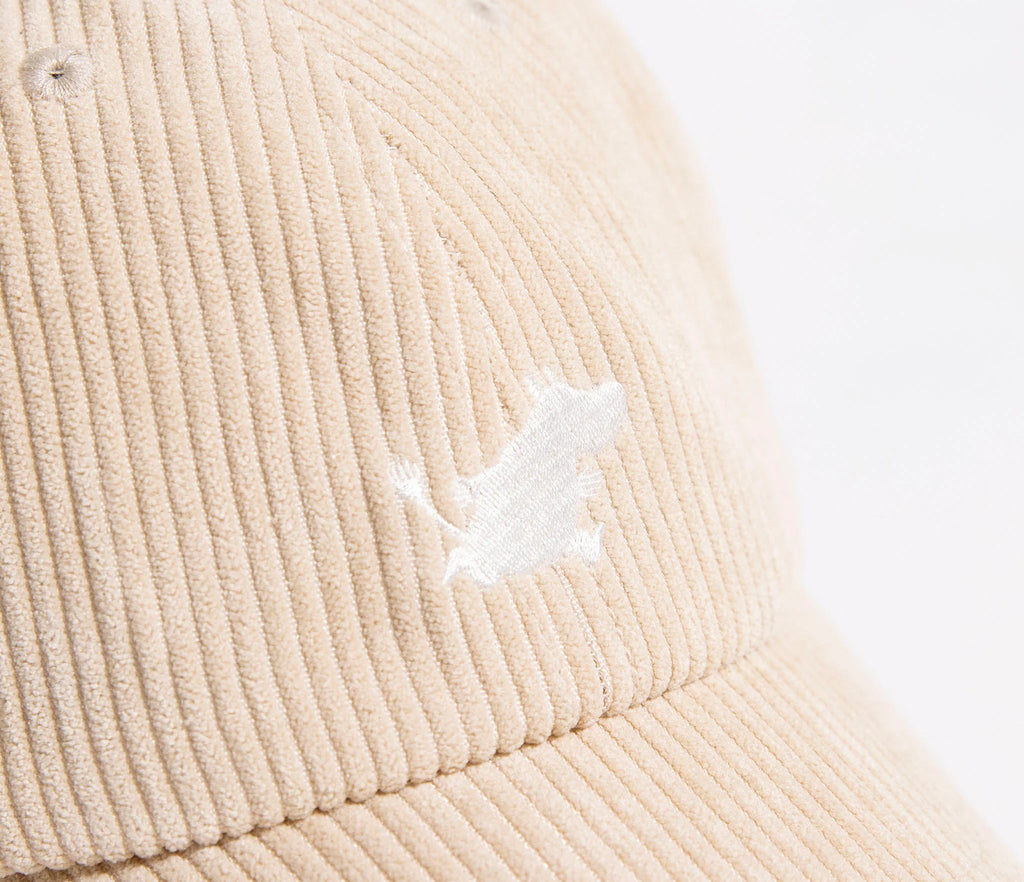 6. Close-up of Moomintroll logo on sand corduroy cap