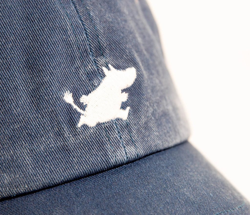 6. Close-up of Moomintroll logo on blue washed denim cap