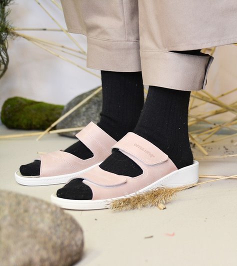 1. Women's professional ergonomic sandals in light pink by OmaKing, worn with black socks and beige pants in a lifestyle setting