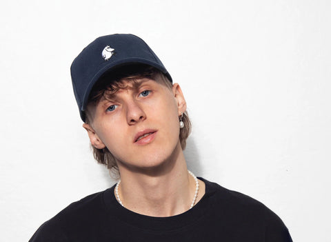 1. Men's navy Moominpappa corduroy cap by Moomin, worn by model in studio setting