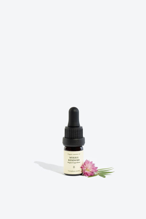 1. Smells Like Spells MYRRH RESINOID Essential Oil in 5 ml glass bottle with pipette, shown with flower accent
