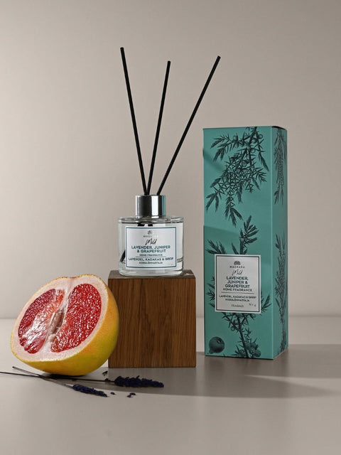1. Magrada Organic Cosmetics home fragrance 'Mild' with lavender, juniper, and grapefruit, 100 ml bottle with natural reed sticks, shown with packaging and grapefruit slice
