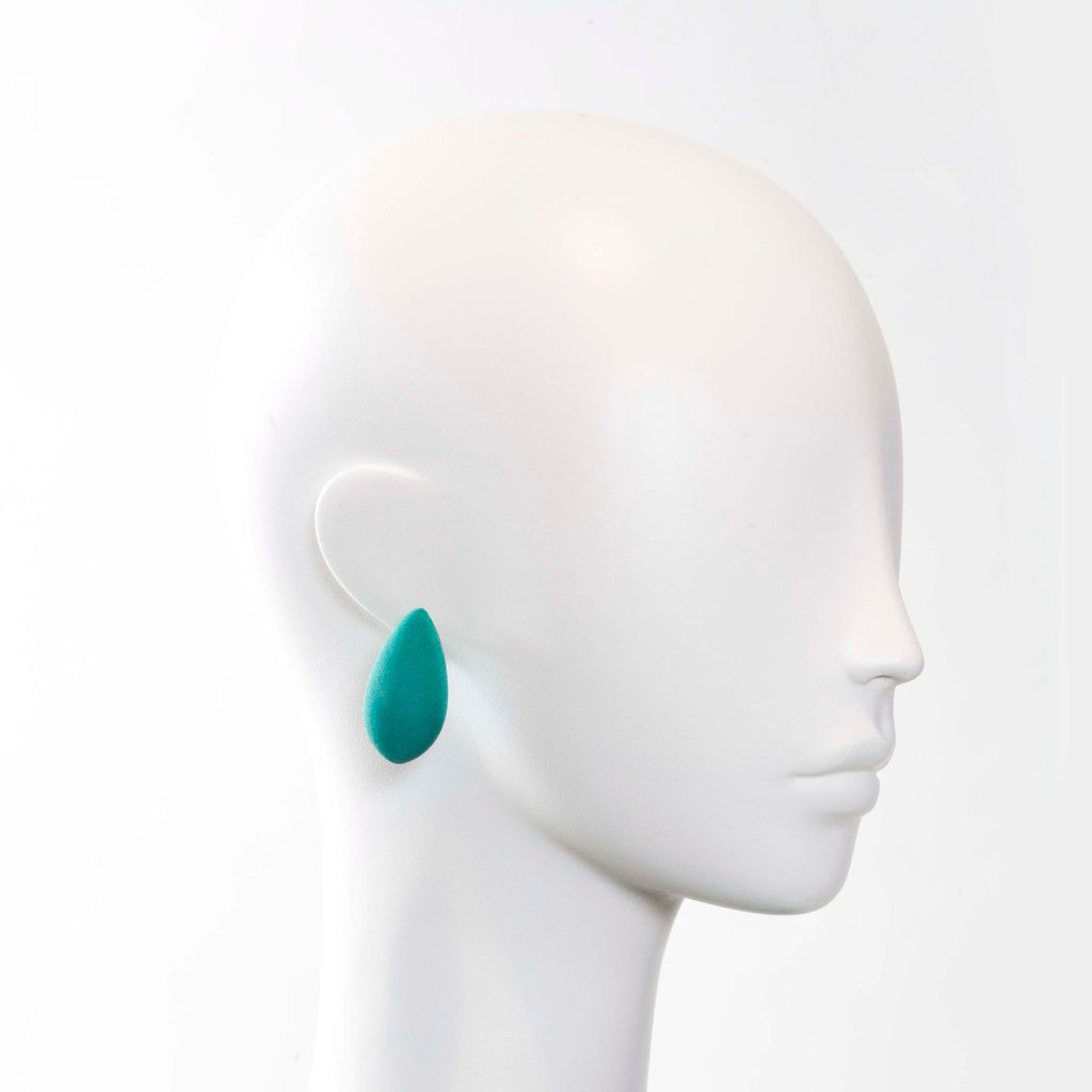 1. Teal Mega Mangoes Earring by Tanel Veenre worn on mannequin head, showcasing size and style
