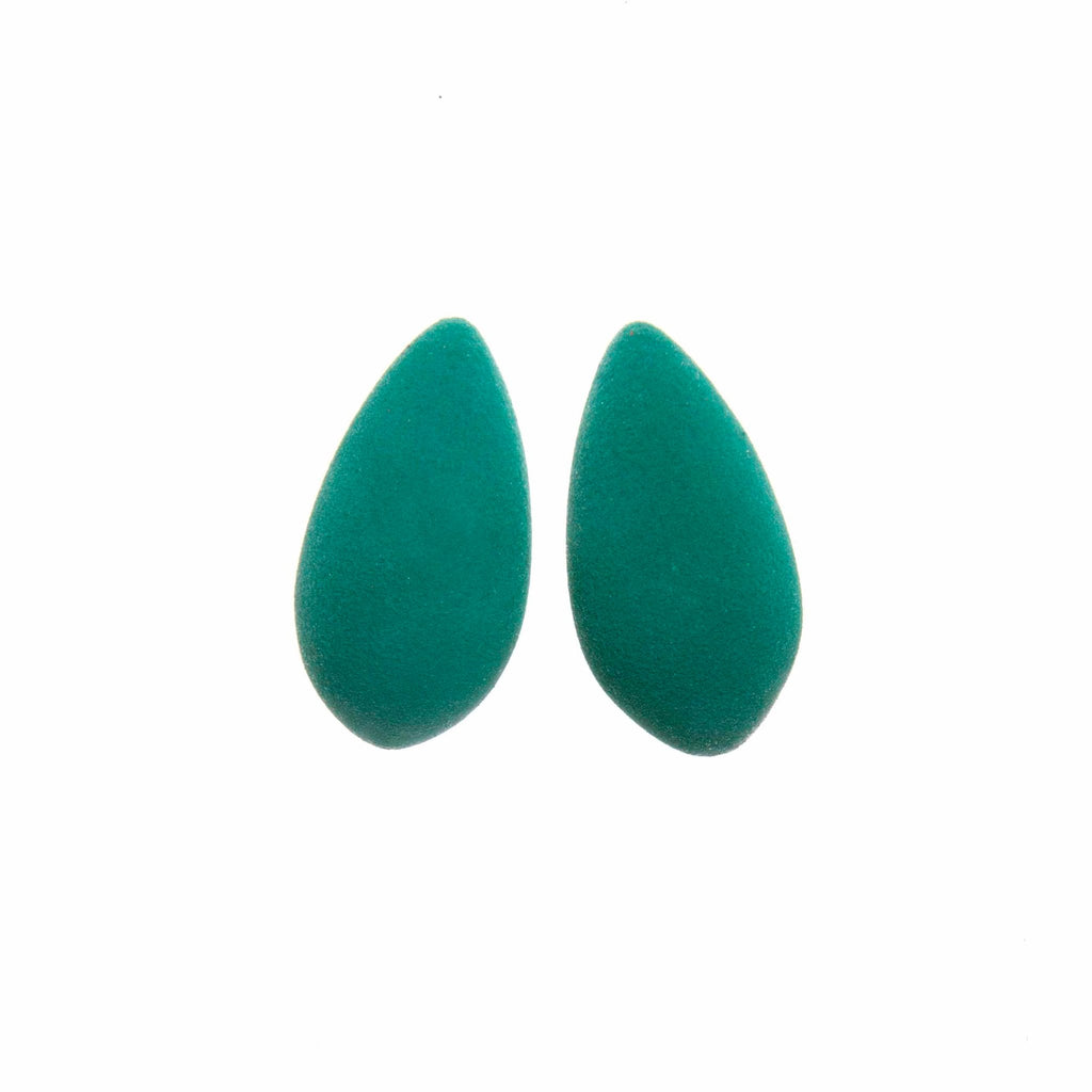 2. Pair of teal Mega Mangoes Earrings by Tanel Veenre with velvety cosmic dust coating on white background
