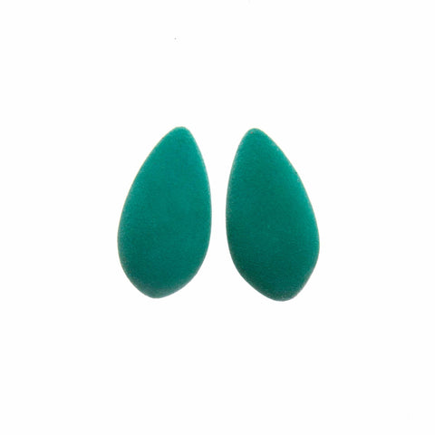 2. Pair of teal Mega Mangoes Earrings by Tanel Veenre with velvety cosmic dust coating on white background