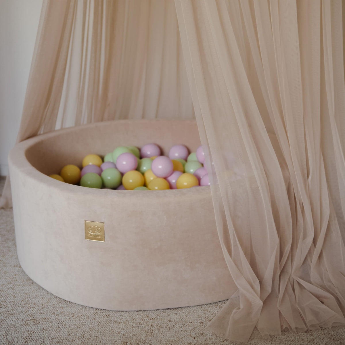 3. Beige MeowBaby foam ball pit with pastel balls under sheer curtains