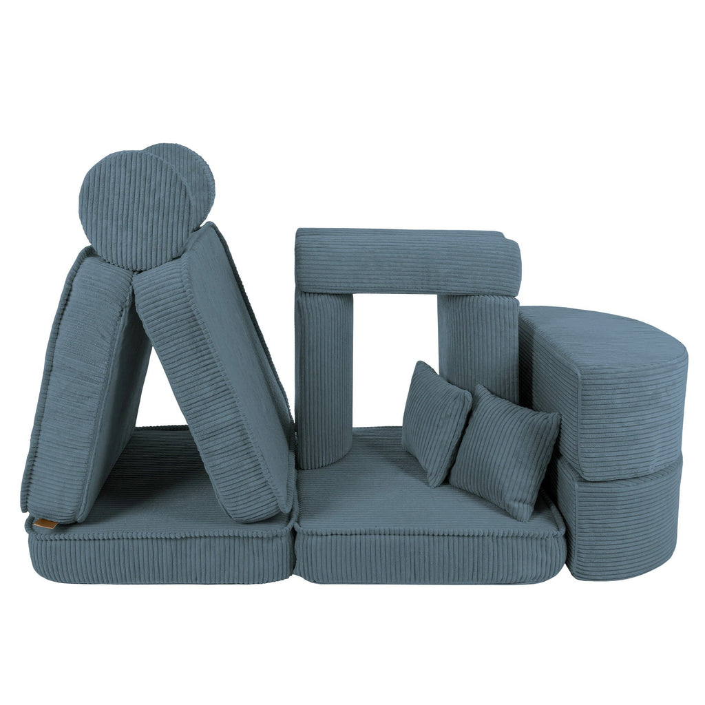 4. Creative arrangement of medium modular children's sofa in aesthetic turquoise, forming a play structure with ribbed texture, shown in a studio setting