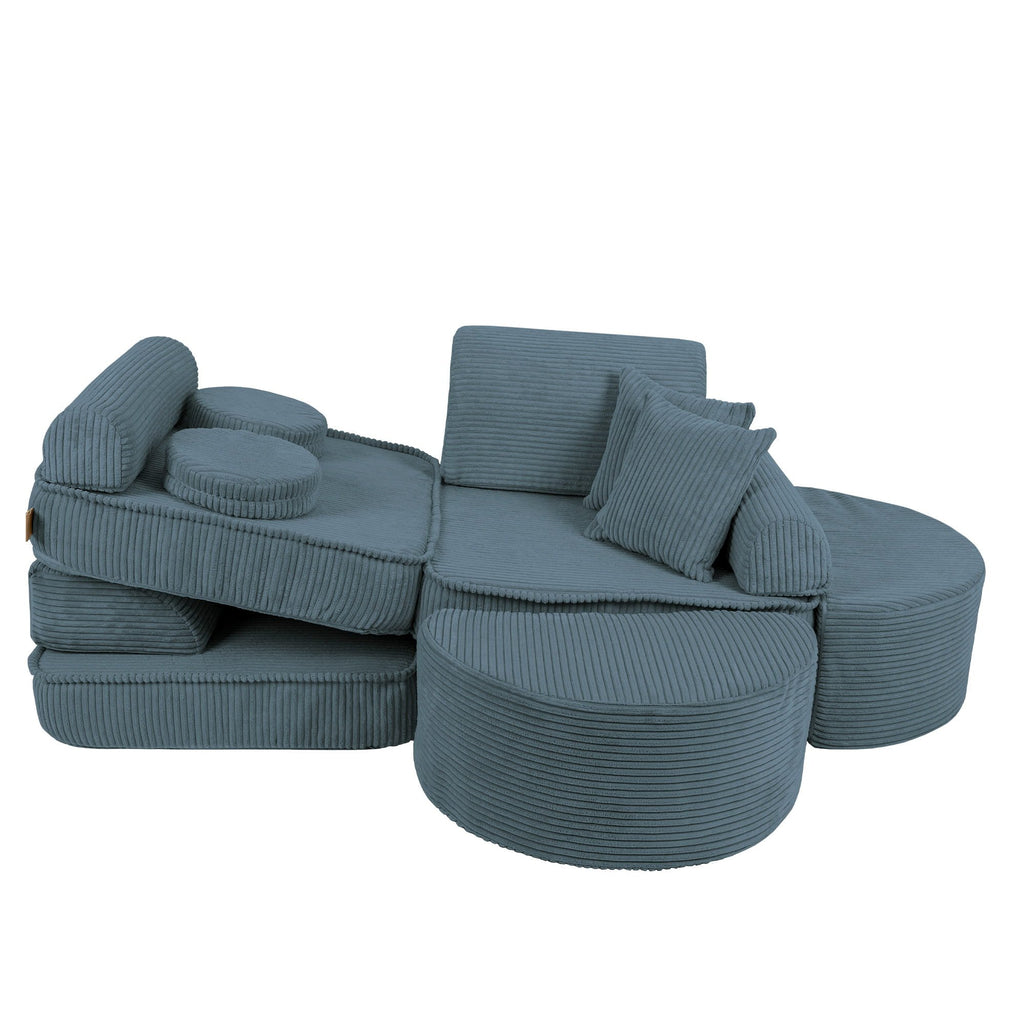 3. Side view of medium modular children's sofa in aesthetic turquoise with ribbed texture, featuring adjustable backrests and cushions, shown in a studio setting