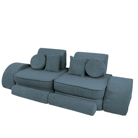 2. Medium modular children's sofa in aesthetic turquoise with ribbed texture, featuring multiple cushions and adjustable sections, shown in a studio setting
