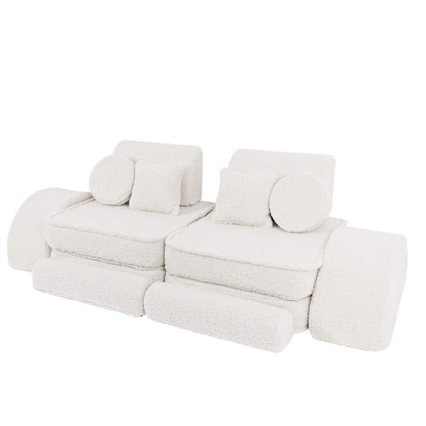 4. Modular children's sofa in bearly cream color with cylindrical and square cushions, arranged in a linear setup