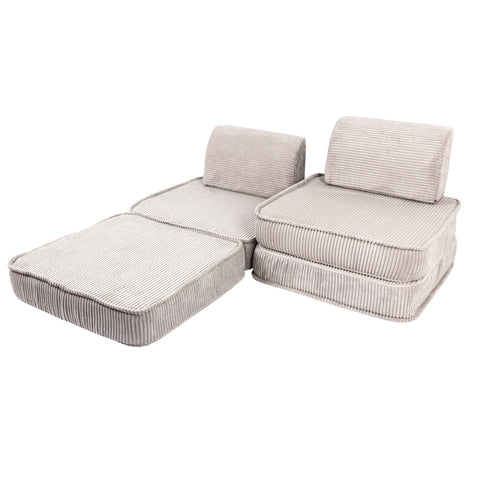 2. Ecru modular children's sofa with ribbed texture, arranged in a split configuration with one seat extended, on a white background