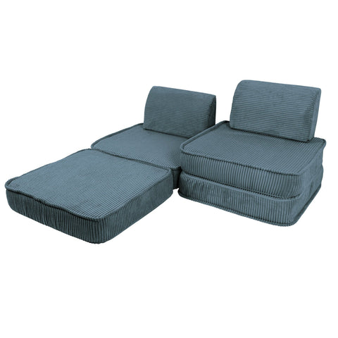 2. Modular children's sofa in aesthetic turquoise, arranged with one section extended as a footrest, showcasing versatility in a studio setting.